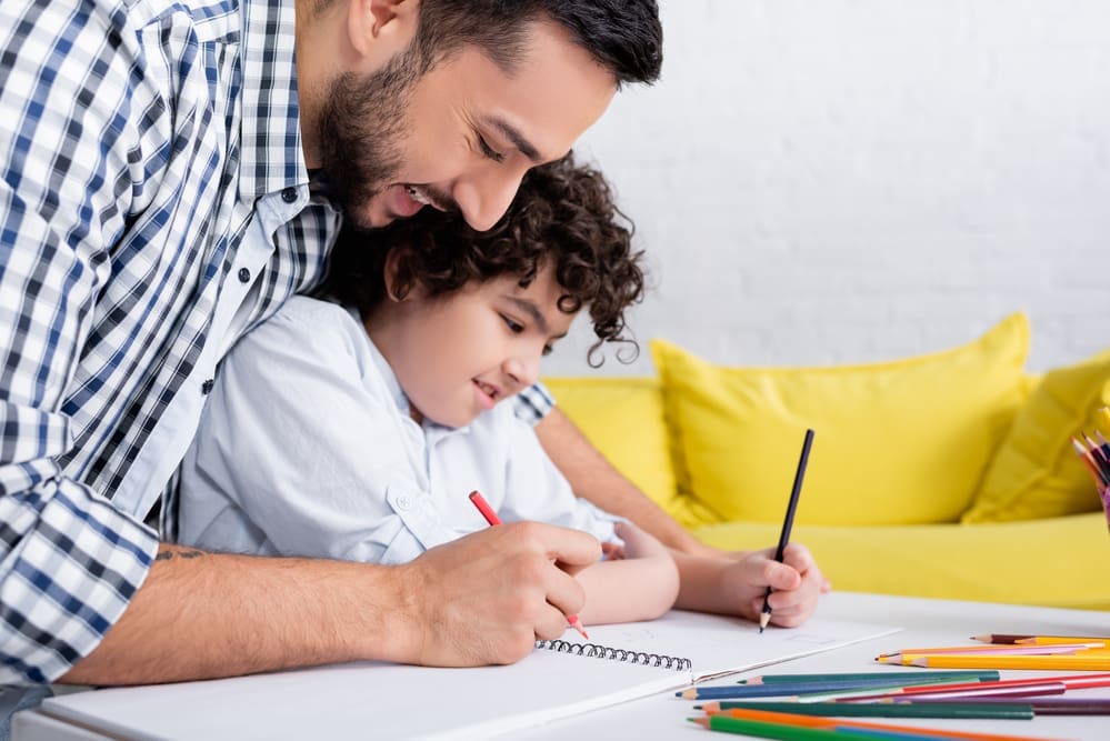 Dad helping son with homework