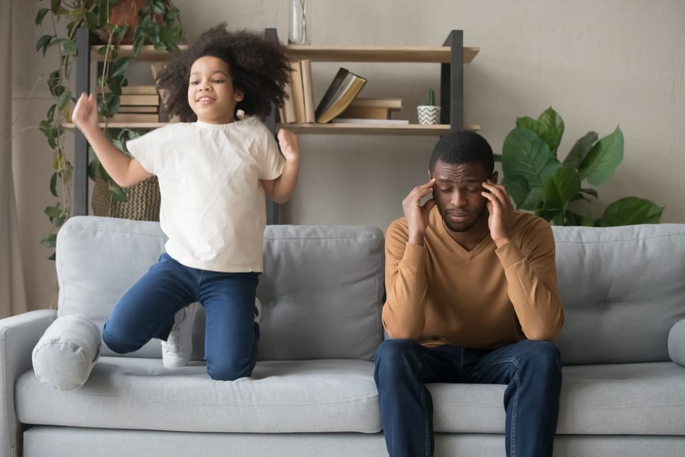 adhd girl jumping on sofa